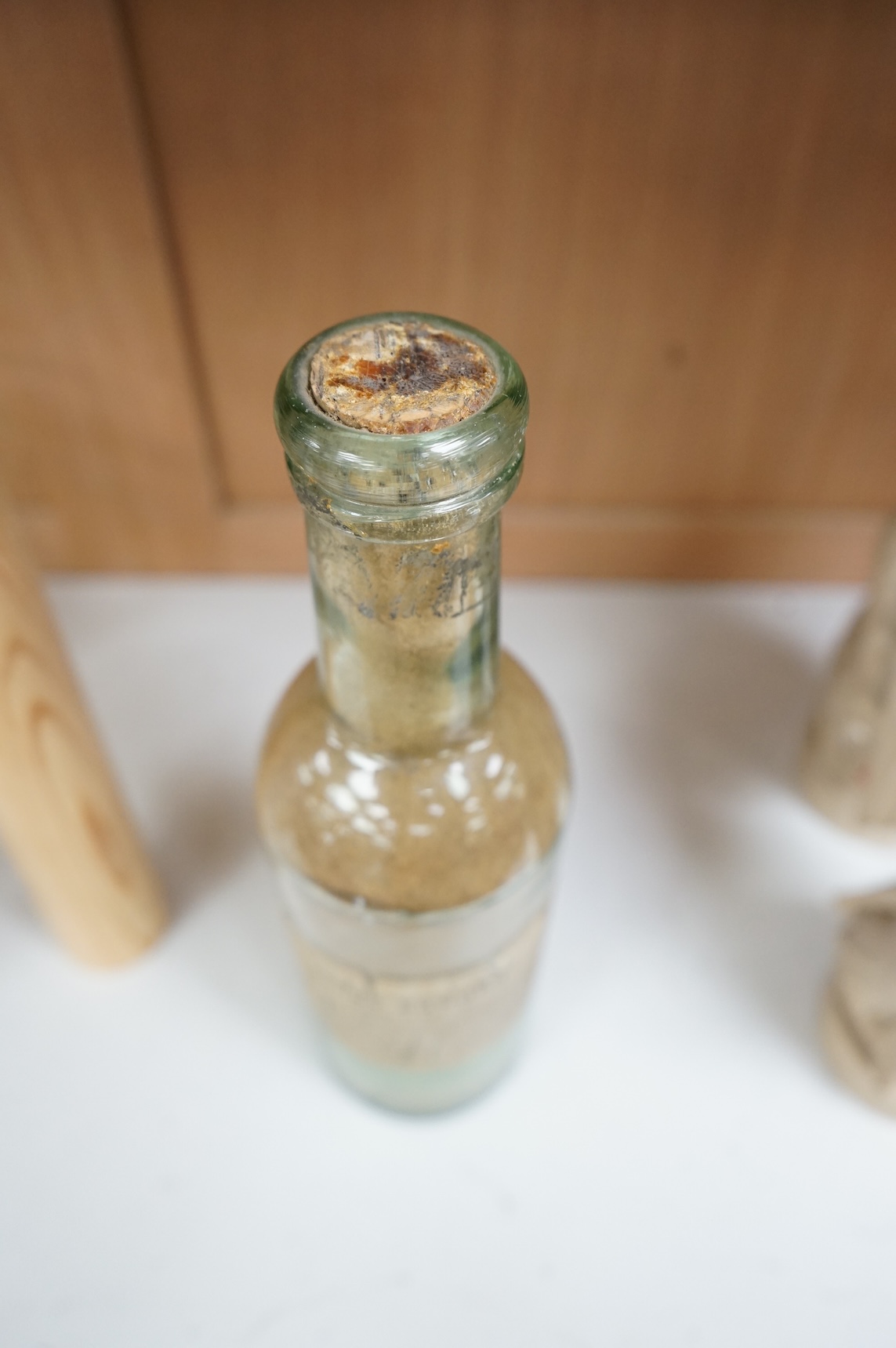A 19th century sealed bottle of Indian curry powder, with original labels, 28cm high